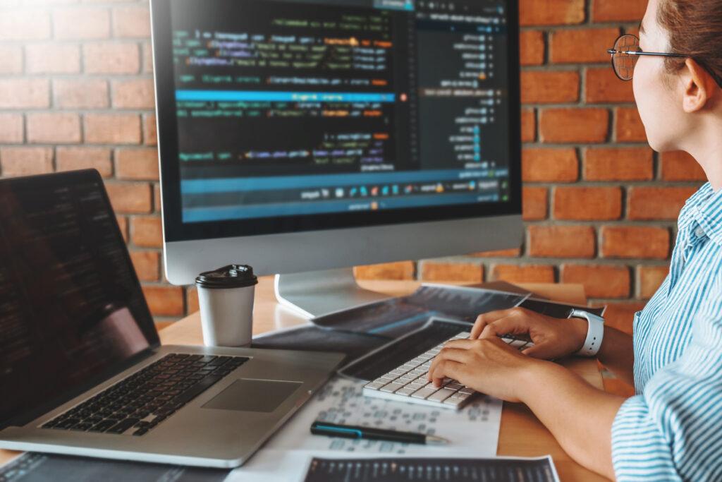 Person coding on a computer